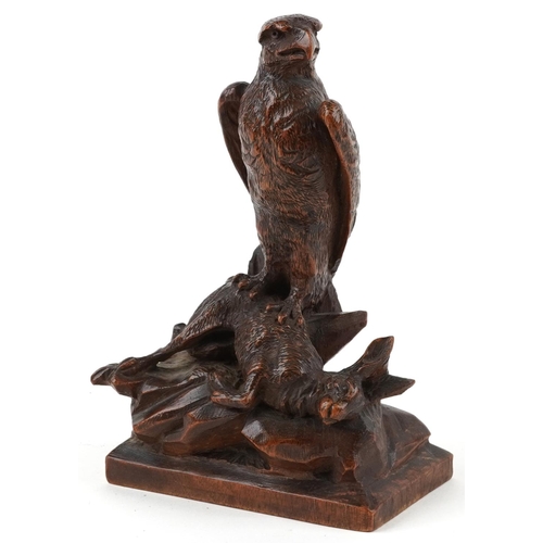 93 - German Black Forest carving of an eagle with it's catch, 22.5cm high