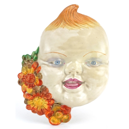 110 - Clarice Cliff, Art Deco face mask in the form of a young red headed boy, 19.5cm high