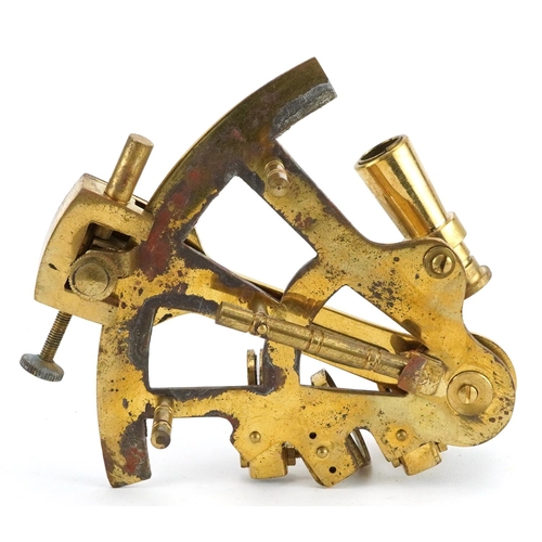 1331 - Shipping interest brass sextant housed in a hardwood case, the sextant 13cm in length