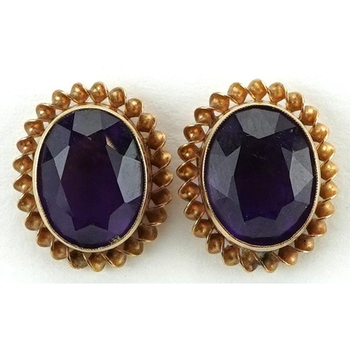 2193 - Pair of 9ct gold amethyst solitaire stud earrings, 1.4cm high, 2.4g