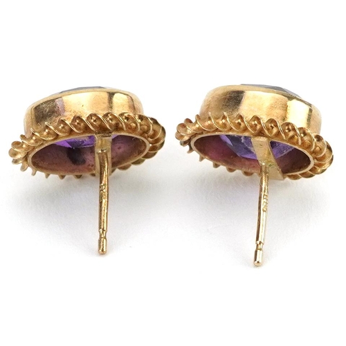 2193 - Pair of 9ct gold amethyst solitaire stud earrings, 1.4cm high, 2.4g