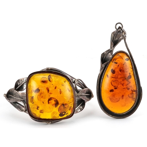 2709 - Large silver natural amber pendant and cuff bracelet with naturalistic setting, the pendant 8.5cm hi... 