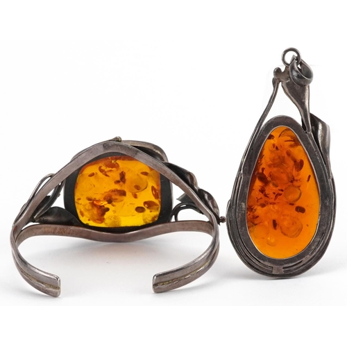 2709 - Large silver natural amber pendant and cuff bracelet with naturalistic setting, the pendant 8.5cm hi... 