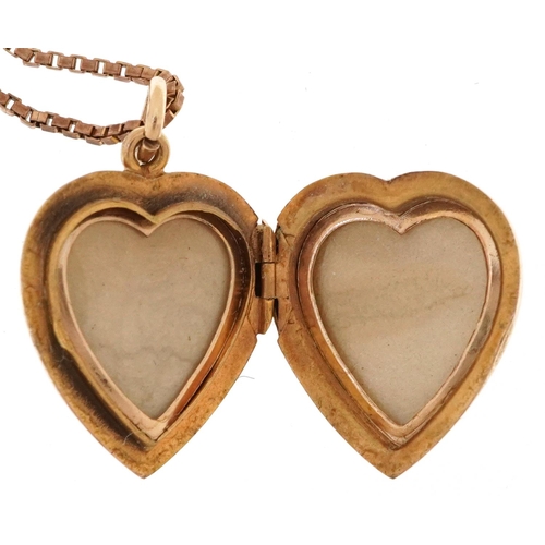 2195 - 9ct gold floral engraved love heart locket and a broken 9ct gold box link necklace, the locket 2.2cm... 