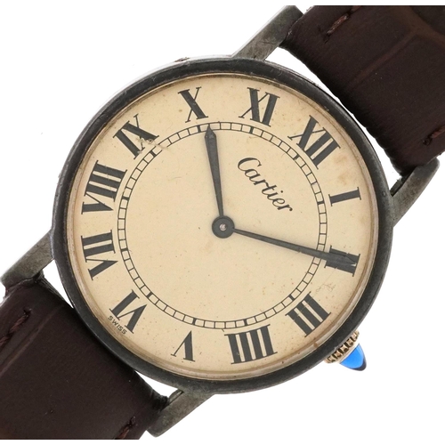 2014 - Cartier, gentlemen's silver wristwatch having cream dial with Roman numerals and cabochon sapphire c... 