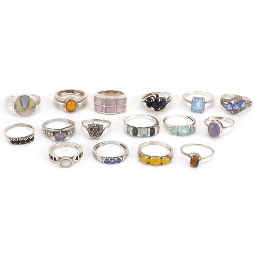 2683 - Sixteen silver rings, some set with semi precious stones, including amethyst, tiger's eye, sapphire ... 