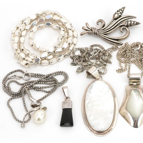 2729 - Silver jewellery, some set with semi precious stones, including floral engraved locket, pendants on ... 