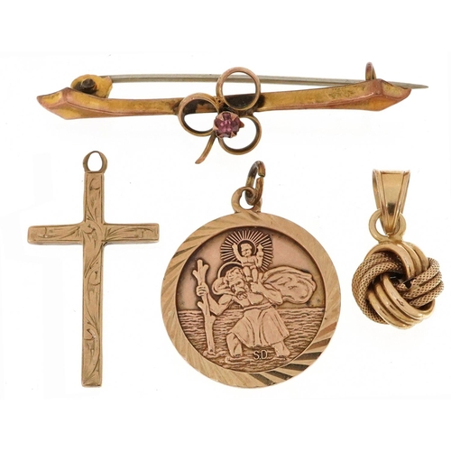 2564 - 9ct gold jewellery comprising St Christopher pendant, engraved cross pendant, knot design pendant an... 