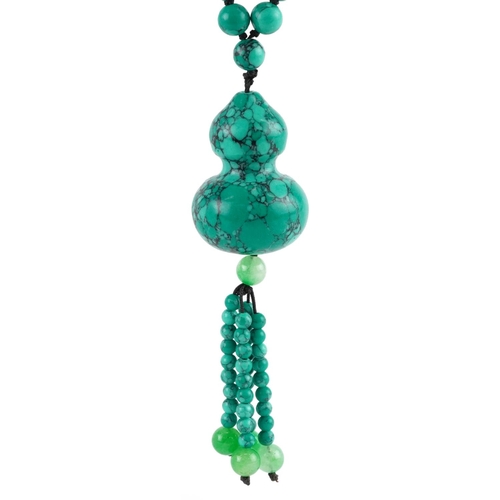 2178 - Turquoise matrix necklace with double gourd pendant and green jade tassels, 84cm in length, 104.5g