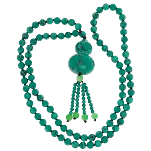 2178 - Turquoise matrix necklace with double gourd pendant and green jade tassels, 84cm in length, 104.5g