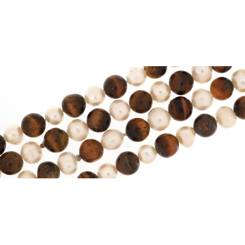 2601 - Two freshwater pearl and tiger's eye bead necklaces, each 120cm in length, total 214.3g