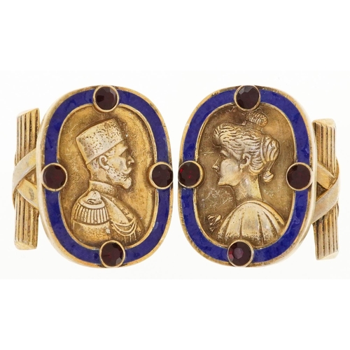 2526 - Pair of silver gilt and blue enamel portrait cufflinks set with red stones, impressed Russian marks,... 