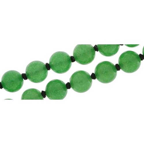 2452 - Chinese green jade bead necklace, each bead 8mm in diameter, overall 68cm in length, 56.8g