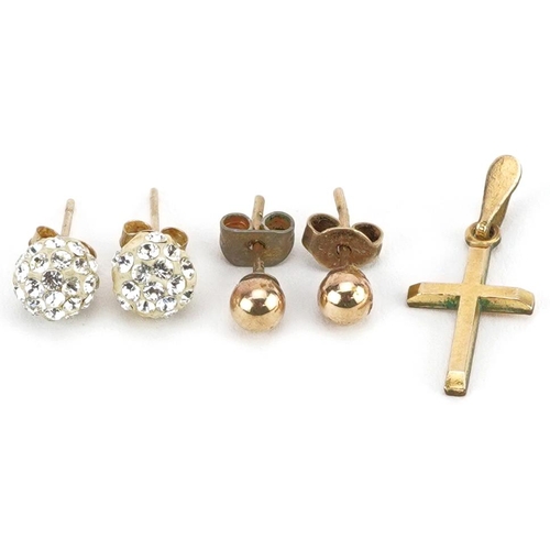 2529 - Two pairs of 9ct gold ball stud earrings and a yellow metal cross pendant, one pair set with clear s... 