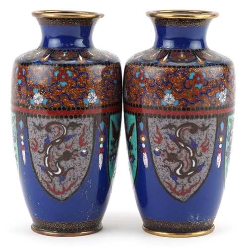 20 - Pair of Japanese cloisonne vases enamelled with panels of stylised dragons and birds of paradise, ea... 
