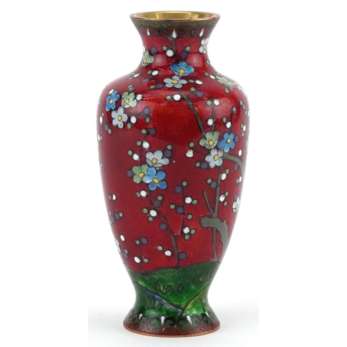 84 - Japanese cloisonne vase enamelled with a Geisha in a landscape with flowers, 13.5cm high