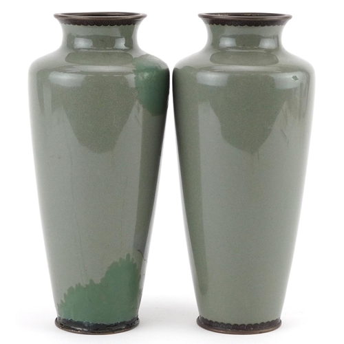 82 - Pair of Japanese cloisonne vases, each enamelled with a man sweeping, each 19cm high