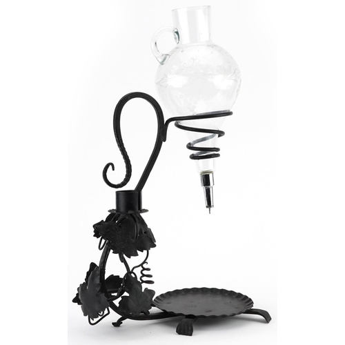 1305 - 19th century style iron and glass wine decanter, 47.5cm high