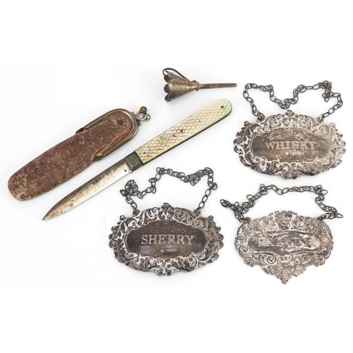 391 - Victorian and later silver objects comprising three decanter labels, mother of pearl flanked folding... 