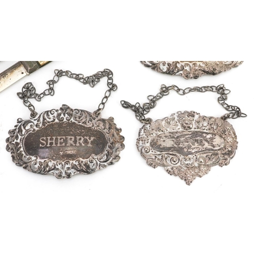 391 - Victorian and later silver objects comprising three decanter labels, mother of pearl flanked folding... 