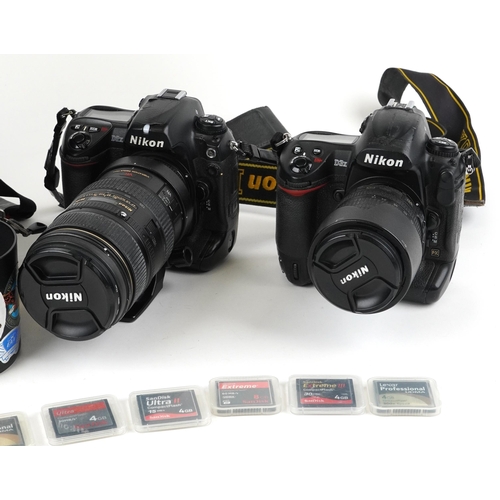 1244 - Two Nikon cameras with accessories comprising Nikon D3X with 80-105mm DX lens and Nikon D2X with 80-... 