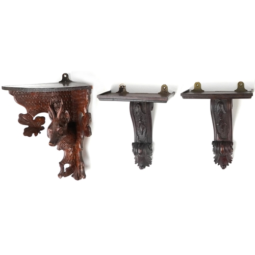 387 - 19th century and later treen wall brackets including a German Black Forest example carved in relief ... 