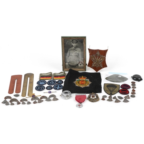 629 - Militaria including a dosimeter, two Blakey's Wartime Boot Protector packs and a black and white pho... 