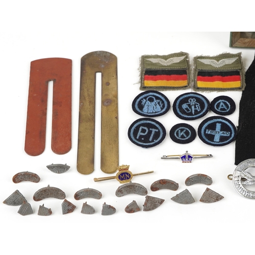 629 - Militaria including a dosimeter, two Blakey's Wartime Boot Protector packs and a black and white pho... 