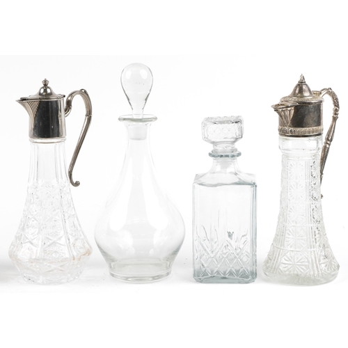 1393 - Glass decanters and claret jugs including a pair of Edinburgh Crystal decanters and a claret jug in ... 