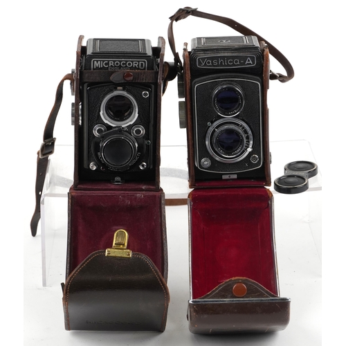 1250 - Two vintage cameras with cases comprising Yashica-A and Microcord