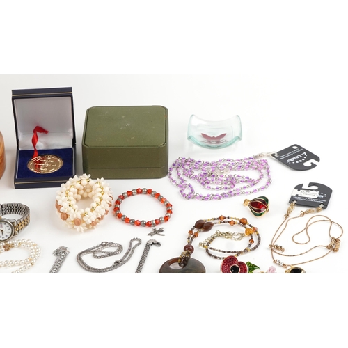 2798 - Costume jewellery and wristwatches including enamelled brooches, earrings, necklaces and a maple eff... 