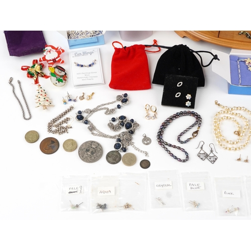 2798 - Costume jewellery and wristwatches including enamelled brooches, earrings, necklaces and a maple eff... 