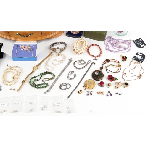 2798 - Costume jewellery and wristwatches including enamelled brooches, earrings, necklaces and a maple eff... 