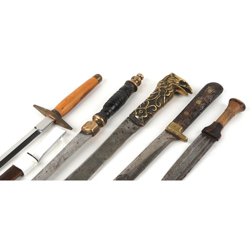 673 - Five edged weapons including example with brass eagle design handle, the largest 46cm in length