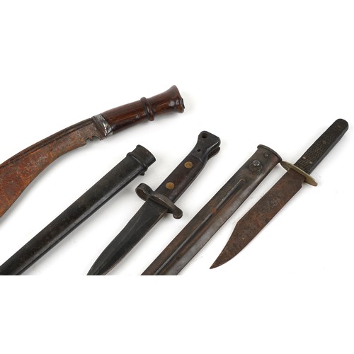 669 - Military interest edged weapons and two scabbards including a Gurkha's knife, the largest 54cm in le... 