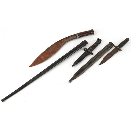 669 - Military interest edged weapons and two scabbards including a Gurkha's knife, the largest 54cm in le... 