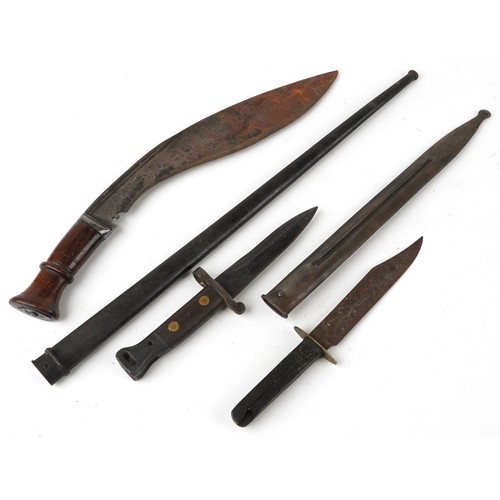 669 - Military interest edged weapons and two scabbards including a Gurkha's knife, the largest 54cm in le... 