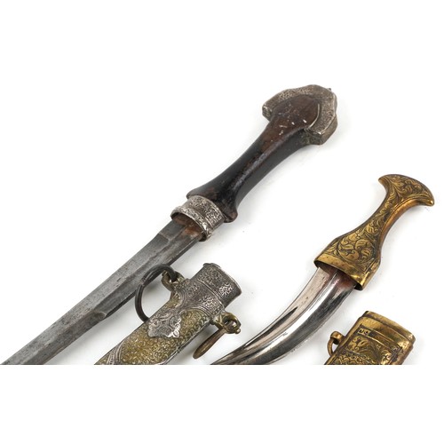 674 - Two Islamic knives including one with silver overlaid brass sheath, 40.5cm in length