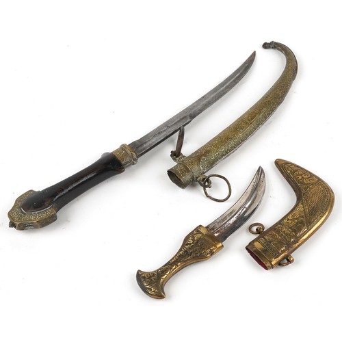 674 - Two Islamic knives including one with silver overlaid brass sheath, 40.5cm in length