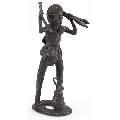 69 - African tribal interest patinated metal figure of a tribesman, possibly Benin, 34cm high