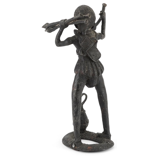 69 - African tribal interest patinated metal figure of a tribesman, possibly Benin, 34cm high