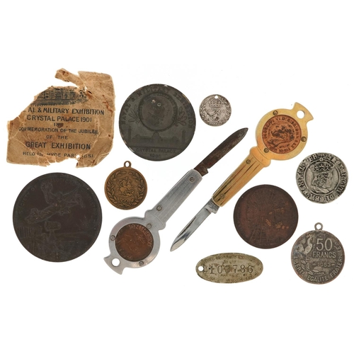 1700 - Coins and medallions including two Penny-Farthing folding pocket knives and an Earls Court Gigantic ... 