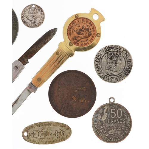 1700 - Coins and medallions including two Penny-Farthing folding pocket knives and an Earls Court Gigantic ... 