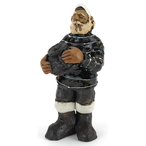 1375 - Studio pottery figure of a fisherman, 14cm