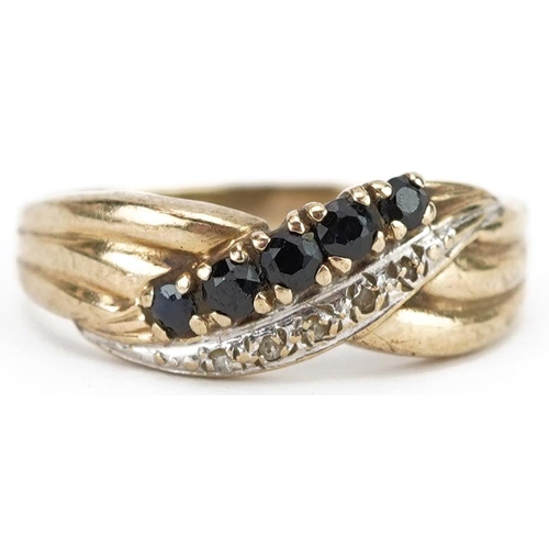 2488 - 9ct gold diamond and sapphire two row crossover ring, size N, 2.2g