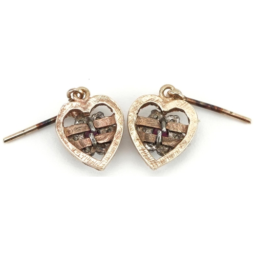 2105 - Pair of unmarked gold diamond and ruby love heart drop earrings, test as 9ct gold, 1.8cm high, 1.8g