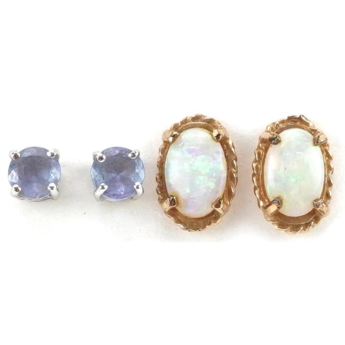 2431 - Two pairs of 9ct gold stud earrings set with iolite and cabochon opals, the largest 7.6mm high, tota... 