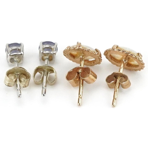 2431 - Two pairs of 9ct gold stud earrings set with iolite and cabochon opals, the largest 7.6mm high, tota... 