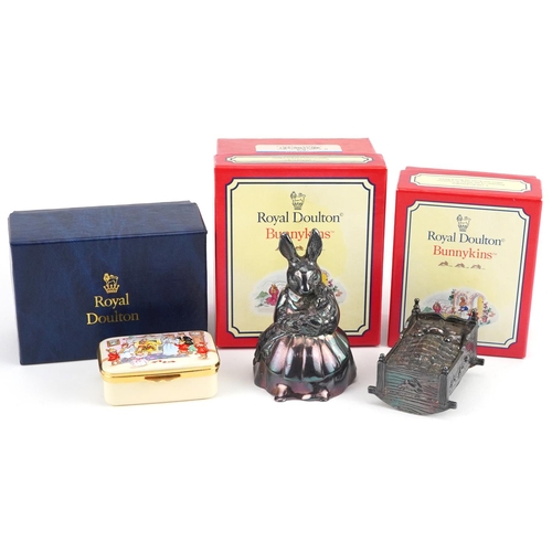 1161 - Two Royal Doulton Bunnykins musical boxes and a Royal Doulton enamelled box commemorating the millen... 