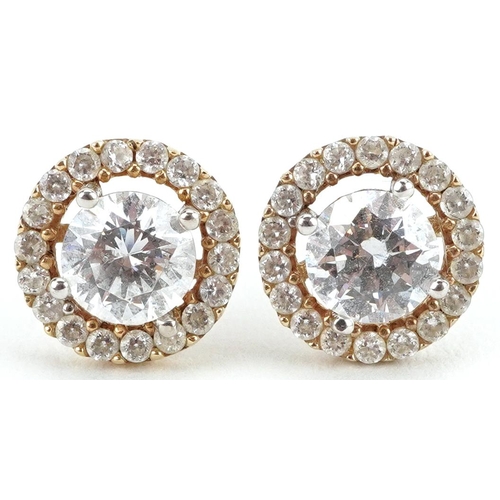 2504 - Pair of unmarked gold clear stone cluster stud earrings, tests as 9ct gold, 9mm in diameter, 1.8g